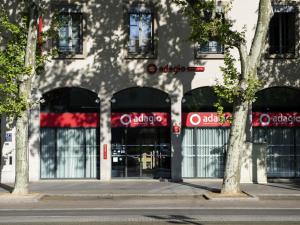 a building with a store front with windows at Aparthotel Adagio Lyon Patio Confluence in Lyon
