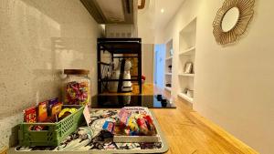 a kitchen counter with a tray of candy on the floor at La Bulle Millésimée - à deux pas de la Gare et de l'Avenue de Champagne in Épernay