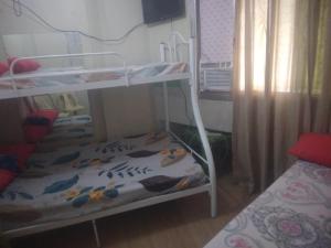 Ένα ή περισσότερα κρεβάτια σε δωμάτιο στο Quickshape Homestay