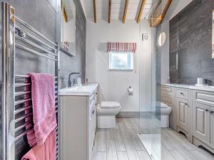 a bathroom with a sink and a toilet at The Rose- Uk47155 in Burgh le Marsh