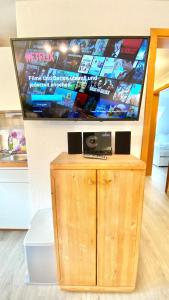 Et tv og/eller underholdning på Ferienhaus MAGELLAN '2'