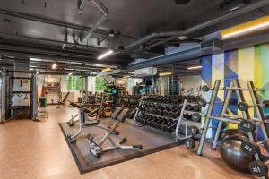 a gym with lots of exercise equipment and weights at Blueground Downtown rooftop nr Marymoor Park SEA-890 in Redmond
