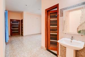 a bathroom with a sink and a closet at HOTEL O BLISS INN GUEST HOUSE in Gorakhpur