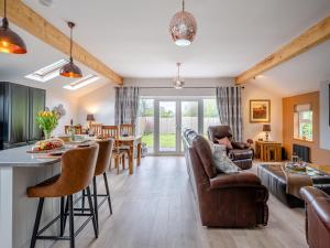 a living room with a kitchen and a living room at Briar Cottage in Great Eccleston
