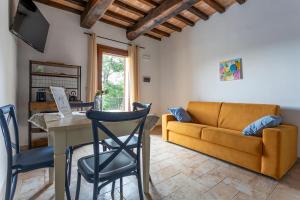 a living room with a couch and a table at Relais e Spa l'Antica Fornace in Città della Pieve
