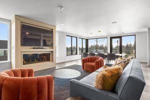 a living room with a couch and a fireplace at Blueground Meridian Park view nr Shoreline Park SEA-932 in Shoreline