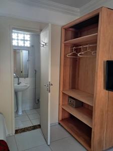a bathroom with a toilet and a sink at Hotel Pousada Acácia da Barra in Salvador +129 photos
