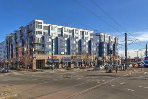 a large building on the corner of a city street at Blueground Brighton fitness center nr Park SEA-876 in Seattle