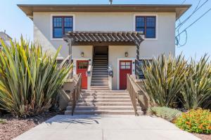 a house with a red door and some plants at Blueground Downtown North view nr Stanford SFO-2012 in Palo Alto