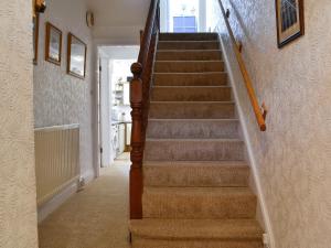 a staircase in a home with a stair case at Robinson in Keswick