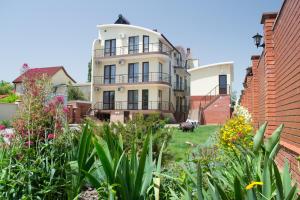 a house with a garden in front of it at Kosmos 519 in Zatoka