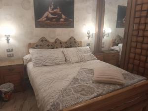 a bedroom with a bed and a large mirror at Quiet Living in Cairo
