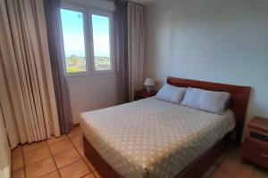 a bedroom with a bed and a window at PoolParadise Tu mejor opción in San Jorge +27 photos