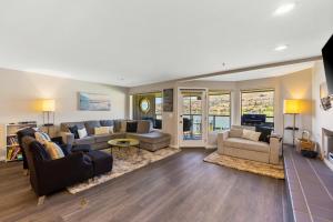 a large living room with a couch and a table at Sunsets at Lake Chelan Petersons #324 in Chelan