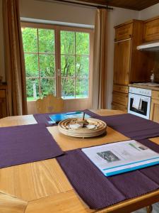 a wooden table with a plate on top of it at Ferienwohnung Susanne Hillbrand in Bad Aussee