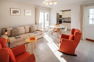 a living room with a couch and chairs and a table at VILLA ALAY by Buenavilla in Playa Blanca