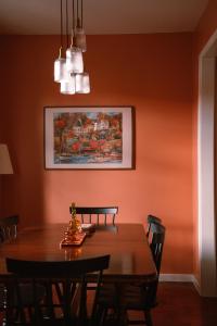 a dining room with a wooden table and chairs at Casa d'Avo - 3BD cosy home in Funchal