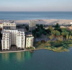 an aerial view of a resort on the water at AmyMamaia marina blue in Mamaia