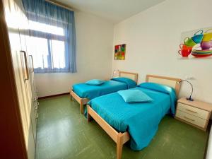 Ένα ή περισσότερα κρεβάτια σε δωμάτιο στο Cozy flat in a villa with terrace