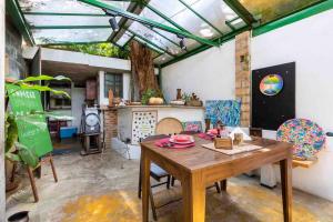 a dining room with a wooden table and chairs at Espaço Spa in São Paulo