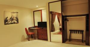 Cama o camas de una habitación en Al Liwan Suites