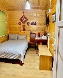 a bedroom with a bed and a desk and a table at Casa Beijing in Braşov