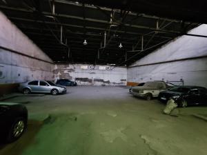 a parking garage with several cars parked in it at Rincón Verde 1 in San Miguel de Tucumán