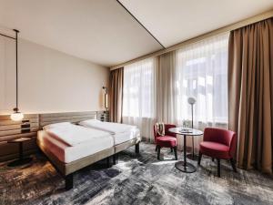 Giường trong phòng chung tại Novotel Münster City +76 ảnh