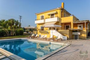 a villa with a swimming pool in front of a house at Ktima KiKa - Private Pool Escape & Tranquility in Kyparissia