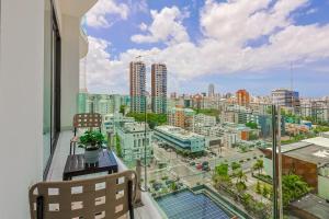 a balcony with a view of a city at Upscale Condo, Spectacular Views in Carlos Guerra