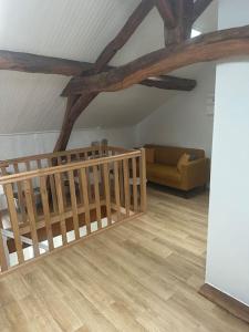 a living room with a couch and a wooden ceiling at Maison familiale in Razès