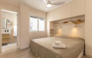 a bedroom with a large bed in a room at Stunning Apartment In Guardamar Del Segura in El Moncayo +12 photos