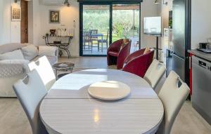 a kitchen and living room with a table and chairs at Awesome Home In Brignoles in Brignoles