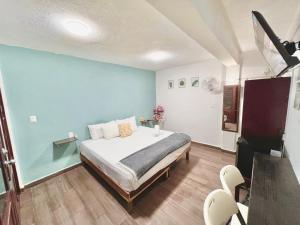 Postel nebo postele na pokoji v ubytování Habitaciones Bacalar MYD