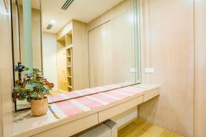 a dressing room with a mirror and a potted plant at 188 Suites by KidsCastle in Kuala Lumpur +35 photos