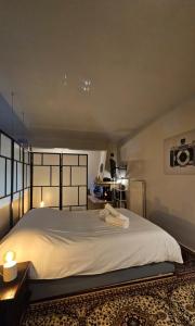 a bedroom with a large white bed in a room at Escape to the mountain 