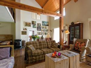 a living room with a couch and a table at Peace, Nature & Comfort Combined in Cetturu