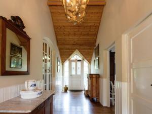 a hallway with a wooden ceiling and a chandelier at Peace, Nature & Comfort Combined in Cetturu