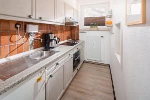 Η κουζίνα ή μικρή κουζίνα στο Haus Seute Deern - Whg. Bilge +8 φωτογραφίες