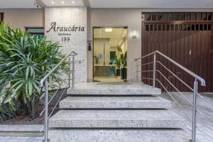 a set of stairs in front of a building at Apto c/ varanda e churrasq. a 290m do mar CAU0199 in Meia Praia