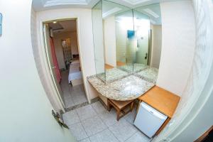 an overhead view of a bathroom with a large mirror at Hotel Copamar in Rio de Janeiro
