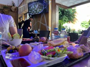 a table with a bunch of food on it at Studio sky lux 94 in Tangier