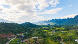 an aerial view of a village in the mountains at Ha Giang Green Garden Dorm in Na Lang +8 photos