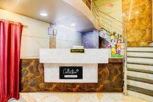 a bathroom with a sign on the wall at Collection O Ambedkar Chowk Ulhasnagar in Mumbai