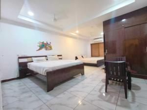 Ένα ή περισσότερα κρεβάτια σε δωμάτιο στο Collection O Chakripuram Near Khusaiguda Bus Stop