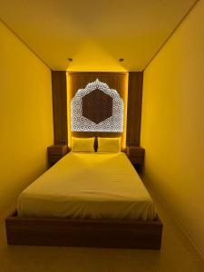 a bedroom with a white bed with a head board at STUDIO HIGH LuX 01 in Tangier