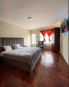 Ένα ή περισσότερα κρεβάτια σε δωμάτιο στο Home Austro loja