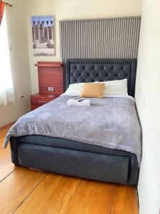 Ένα ή περισσότερα κρεβάτια σε δωμάτιο στο Home Austro loja