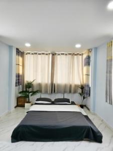 En eller flere senge i et værelse på H2T Hotel Vip