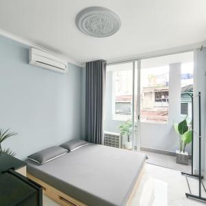 En eller flere senge i et værelse på H2T Hotel Vip